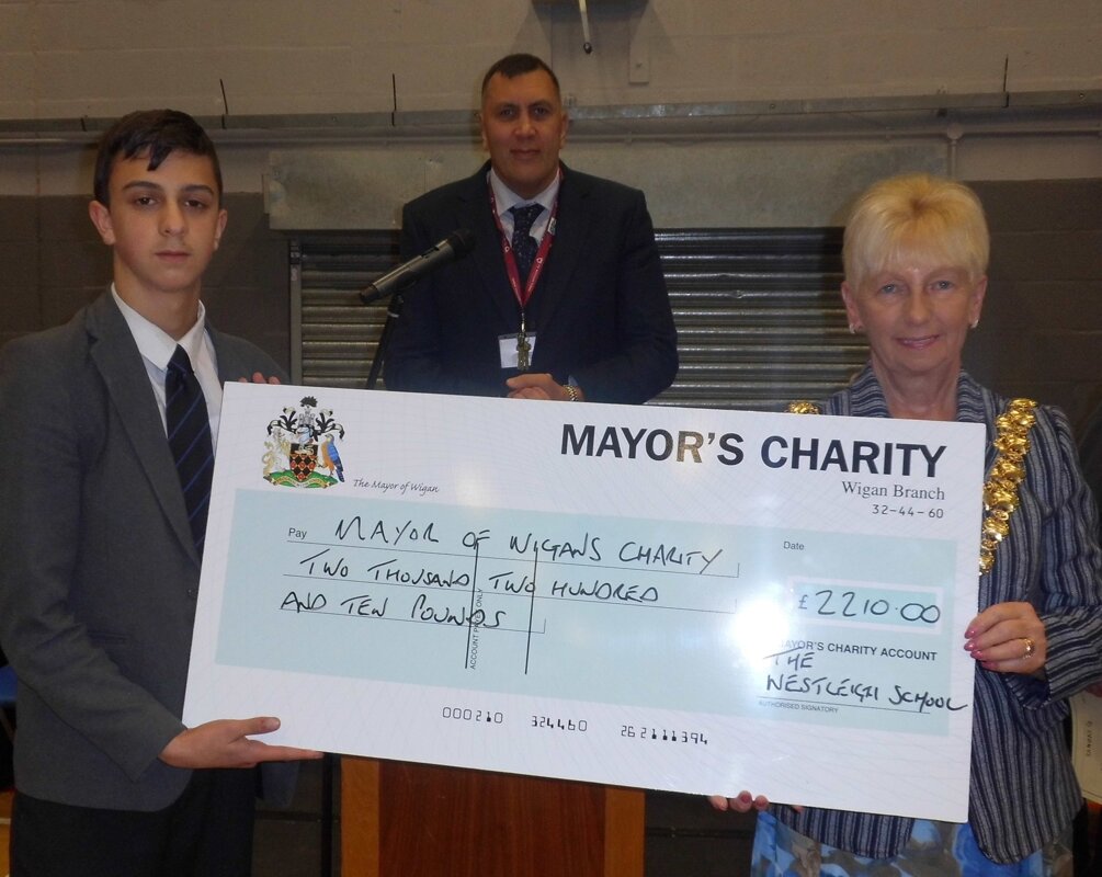 Image of Students present cheque for £2210 to Mayor's Charity Derian House
