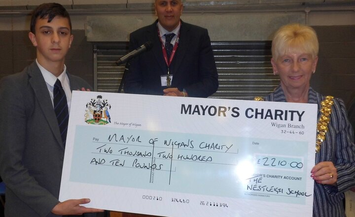 Image of Students present cheque for £2210 to Mayor's Charity Derian House